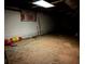 Unfinished basement with exposed ceiling, concrete walls, and scattered buckets and pipes at 5317 Kings Hwy, Douglasville, GA 30135