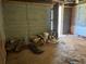 Unfinished basement featuring concrete block walls and a collection of paint cans and supplies at 5317 Kings Hwy, Douglasville, GA 30135