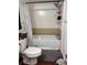 Bathroom includes a tub/shower with a curtain, toilet, and essential fixtures offering basic functionalities at 5317 Kings Hwy, Douglasville, GA 30135