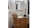 Modest bathroom with a light wood vanity providing under-sink storage and counter space, waiting for an upgrade at 5317 Kings Hwy, Douglasville, GA 30135