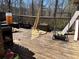 Overhead shot of a wooden deck needing TLC with an outdoor grill and miscellaneous items at 5317 Kings Hwy, Douglasville, GA 30135