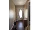 The foyer features a door with an oval glass panel, and neutral walls at 5317 Kings Hwy, Douglasville, GA 30135