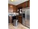 Kitchen with wooden cabinets, stainless steel appliances and black dishwasher at 5317 Kings Hwy, Douglasville, GA 30135