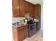 Kitchen features stainless steel oven, wooden cabinets and laminated countertop at 5317 Kings Hwy, Douglasville, GA 30135