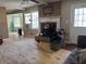 Living room featuring a brick fireplace and windows for plenty of natural light at 5317 Kings Hwy, Douglasville, GA 30135
