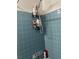 An alcove shower features light blue tiles, a chrome shower head, and a mounted caddy for toiletries at 5317 Kings Hwy, Douglasville, GA 30135