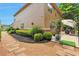 The backyard features a stone paver walkway, lovely shrubs and garden beds at 5613 Lancashire Ln, Cumming, GA 30041