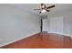 Bedroom with hardwood floors, neutral walls, and a bright window at 5613 Lancashire Ln, Cumming, GA 30041
