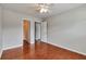 Bedroom with hardwood floors and multiple doors at 5613 Lancashire Ln, Cumming, GA 30041