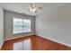 Bedroom with hardwood floors, and bright windows at 5613 Lancashire Ln, Cumming, GA 30041