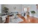 Open living space with stylish seating, a glass coffee table, and wood flooring at 5613 Lancashire Ln, Cumming, GA 30041