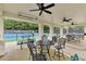 Covered outdoor seating area adjacent to the tennis courts, perfect for relaxation and enjoying the sports facilities at 5613 Lancashire Ln, Cumming, GA 30041