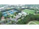 Aerial view of a community featuring tennis courts, a swimming pool, and a clubhouse at 5613 Lancashire Ln, Cumming, GA 30041