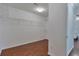 Walk-in closet with hardwood floors and wire shelving at 5613 Lancashire Ln, Cumming, GA 30041