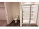 Modern bathroom with a glass-enclosed shower, toilet, and wood-look flooring at 60 Sonoma Drive, Dallas, GA 30157
