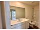 Bright bathroom with white vanity and shower-tub combo at 60 Sonoma Drive, Dallas, GA 30157