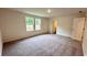 Bright bedroom with neutral walls, plush carpet, and two windows offering natural light at 60 Sonoma Drive, Dallas, GA 30157