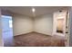 Versatile bonus room with neutral walls, plush carpeting, and access to other rooms at 60 Sonoma Drive, Dallas, GA 30157