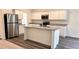 Modern kitchen with stainless steel appliances, granite countertops, and a central island at 60 Sonoma Drive, Dallas, GA 30157