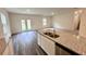 Open floor plan with kitchen island, stainless steel sink, and granite counters at 60 Sonoma Drive, Dallas, GA 30157