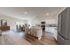 Open concept kitchen featuring granite counters, stainless appliances and view to living and dining areas at 60 Sonoma Drive, Dallas, GA 30157