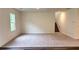Bright living room with neutral carpeting and view of the stairway to the second level at 60 Sonoma Drive, Dallas, GA 30157