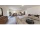 Open-concept living space with kitchen, dining area, and comfortable seating at 60 Sonoma Drive, Dallas, GA 30157