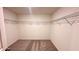 Spacious walk-in closet with wire shelving and neutral carpeting at 60 Sonoma Drive, Dallas, GA 30157