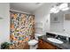Bathroom with a granite countertop and a shower featuring a colorful curtain at 1031 State Nw St # 106, Atlanta, GA 30318