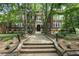 Charming brick building with a landscaped entrance and mature trees, offering a warm and inviting welcome at 1031 State Nw St # 106, Atlanta, GA 30318