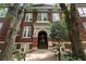 Detailed view of the brick facade and arched entryway of this Home Park School building, showcasing architectural charm at 1031 State Nw St # 106, Atlanta, GA 30318