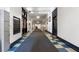 Long hallway with lockers and checkered tile, leading to various rooms in the building at 1031 State Nw St # 106, Atlanta, GA 30318