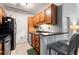 Cozy kitchen featuring stainless steel appliances and dark countertops, with a view into the living area at 1031 State Nw St # 106, Atlanta, GA 30318