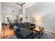 Open-concept living room features high ceilings, hardwood floors, and a comfortable couch with plenty of seating at 1031 State Nw St # 106, Atlanta, GA 30318