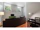 Cozy living room features a comfortable couch, bright windows, and a green accent cabinet at 1031 State Nw St # 106, Atlanta, GA 30318