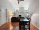 Bright living room with hardwood floors, high ceilings, and large windows, creating a comfortable and inviting space at 1031 State Nw St # 106, Atlanta, GA 30318