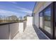 A relaxing balcony featuring neutral tiling, modern railing and glass doors to the interior space at 1145 Kirkwood Se Ave # 14, Atlanta, GA 30316