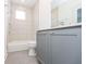 Bathroom features a tub and shower combination and gray vanity at 1145 Kirkwood Se Ave # 14, Atlanta, GA 30316