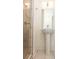 Stylish bathroom featuring tiled shower with glass door, a modern pedestal sink, and minimalist decor at 1145 Kirkwood Se Ave # 14, Atlanta, GA 30316