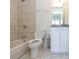 Clean bathroom featuring a shower-tub combo, white vanity, and tiled floors at 1145 Kirkwood Se Ave # 14, Atlanta, GA 30316