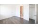Bright bedroom with hardwood floors, a walk-in closet, and an ensuite bathroom at 1145 Kirkwood Se Ave # 14, Atlanta, GA 30316