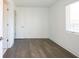 Sunlit bedroom with hardwood floors, white walls, and a window with blinds at 1145 Kirkwood Se Ave # 14, Atlanta, GA 30316