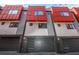Townhome exterior featuring bold red paneling, gray siding and a garage with a black door with glass accents at 1145 Kirkwood Se Ave # 14, Atlanta, GA 30316