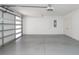 A clean, bright two-car garage featuring painted walls, concrete floor, and an automatic door at 1145 Kirkwood Se Ave # 14, Atlanta, GA 30316