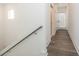 Bright hallway with hardwood floors, white walls and doors leading to other areas of the home at 1145 Kirkwood Se Ave # 14, Atlanta, GA 30316