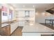 Bright kitchen features white cabinets, stainless steel appliances, and a center island with stone countertops at 1145 Kirkwood Se Ave # 14, Atlanta, GA 30316