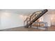 Spacious living room featuring a modern staircase and hardwood floors throughout at 1145 Kirkwood Se Ave # 14, Atlanta, GA 30316