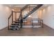 Bright living area with sleek staircase, hardwood floors, and modern design elements at 1145 Kirkwood Se Ave # 14, Atlanta, GA 30316