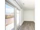 Bright room with wood floors, glass sliding doors to a deck, and neutral walls, offering a versatile living space at 1145 Kirkwood Se Ave # 14, Atlanta, GA 30316