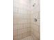 Close-up of a tiled shower showcasing neutral tones and clean lines in a modern bathroom design at 1145 Kirkwood Se Ave # 14, Atlanta, GA 30316